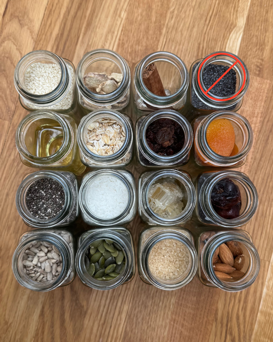 Spice jars with Artisan Granola ingredients including oats, nuts, seeds, and dried fruit, with poppy seeds highlighted as the banned ingredient in the UAE.